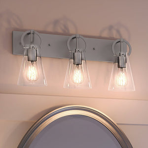 Three gorgeous UEX2542 New Traditional Bath Lights 10''H x 23''W, Polished Nickel Finish, Irvine Collection by Urban Ambiance above a mirror in a bathroom.