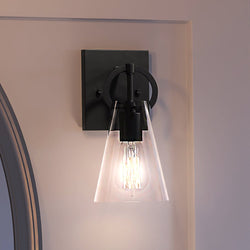 A beautiful UEX2548 New Traditional Wall Sconce 11''H x 4.75''W, Matte Black Finish, Irvine Collection wall sconce with a clear glass shade from