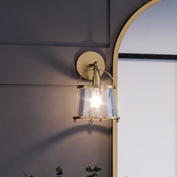 A unique Colonial Wall Sconce lighting fixture with a plant and a mirror by Urban Ambiance.