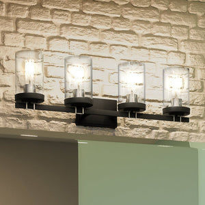 Four beautiful UEX2603 Industrial Lux Bath Light 9''H x 28''W, Polished Chrome & Charcoal Finish, Hampton Collection bathroom fixture with a brick wall.