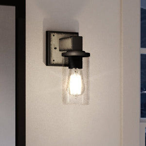 A UEX2610 Industrial Wall Sconce with a beautiful Olde Iron Finish from the Midland Collection by Urban Ambiance.