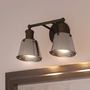 Two Urban Ambiance UEX2644 Modern Farmhouse luxury lighting fixtures hanging above a mirror in a bathroom.