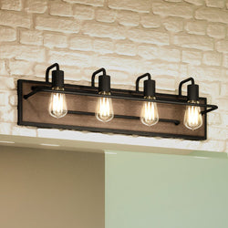 Four UEX2663 Utilitarian Bath Light 8''H x 27''W, Matte Black Finish, Ambridge Collection fixtures hanging above a brick wall showcasing unique lighting fixtures.