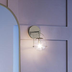 An Urban Ambiance UEX2710 Industrial Lux Wall Sconce 10''H x 6''W with a beautiful mirror on it.