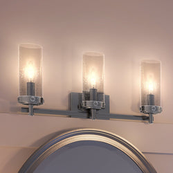 An Urban Ambiance luxury bathroom vanity with three UEX2742 Transitional Bath Lights 9''H x 20''W, Polished Chrome Finish and a mirror.