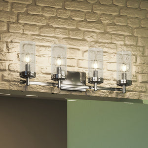 Four beautiful UEX2743 Transitional Bath Light 9''H x 29''W, Polished Chrome Finish, Alexandria Collection lighting fixture with a brick wall.