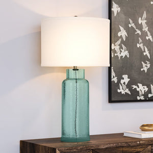A luxury lighting fixture equipped with a UEX7080 Contemporary Table Lamp and a gorgeous green glass shade.