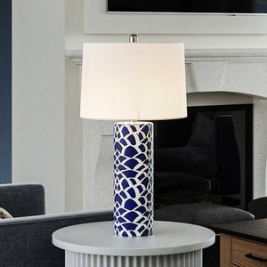 A unique lighting fixture, the UEX7150 Coastal Table Lamp from the Marietta Collection by Urban Ambiance adds a gorgeous touch to any living room with its Navy Blue and White finish.