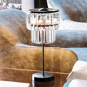 A unique UEX7170 Glam Table Lamp, a luxury lighting fixture with an Oil Rubbed Bronze Finish from the Newberry Collection by Urban Ambiance, adorns a table in a living