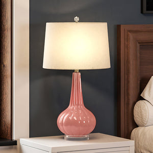 A gorgeous lighting fixture, the UEX7210 Post-Modern Table Lamp from Urban Ambiance adds a touch of elegance to any nightstand.