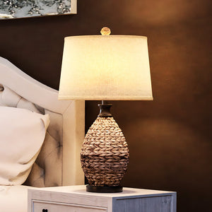A beautiful Urban Ambiance bedside table with a UEX7250 Rustic Table Lamp, Natural Brown Finish.
