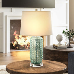 A unique and gorgeous UEX7330 Contemporary Table Lamp in a living room with a fireplace.