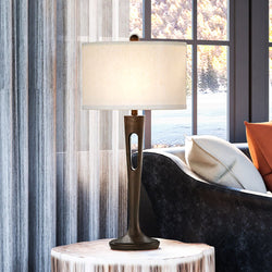 A beautiful Mediterranean table lamp from the Shelburne Collection by Urban Ambiance adds elegance to a living room.