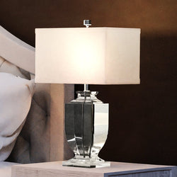 A luxury bed featuring the unique UEX7571 Glam Table Lamp from the Meredith Collection by Urban Ambiance.