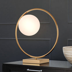 A unique UEX7581 Mid-Century-Modern Table Lamp with an aged brass finish and a glass globe on top from the Sewanee Collection by Urban Ambiance.