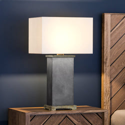 A luxury Chadron Collection bedside table with a UEX7760 Contemporary Table Lamp lighting fixture on it.