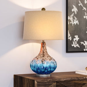 A gorgeous lighting fixture, the UEX7810 Coastal Table Lamp from the Perham Collection by Urban Ambiance adds luxury to any dresser.