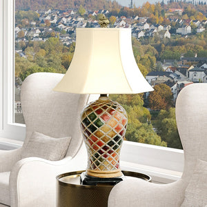 A unique and beautiful UEX7860 Mediterranean Table Lamp in a Multicolor Finish from the Harrisville Collection, proudly placed on a table by Urban Ambiance.