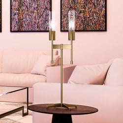 A beautiful living room with a pink couch and an Urban Ambiance UEX7930 Mid-Century-Modern Table Lamp, featuring luxury lighting fixture.