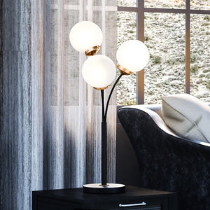 A gorgeous UEX7971 Mid-Century-Modern Floor Lamp from the Leander Collection in a living room with a window.