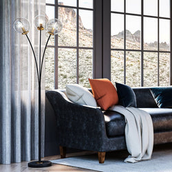 A living room with a unique lighting fixture, the Urban Ambiance UEX7972 Mid-Century-Modern Floor Lamp 24''W x 24''D x 64''H,