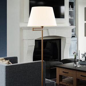 Gorgeous vintage floor lamp in a living room with a fireplace.