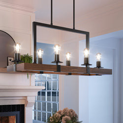 A gorgeous UFS2010 Modern Farmhouse Chandelier, 15''H x 33''W, hanging over a fireplace in a living room.