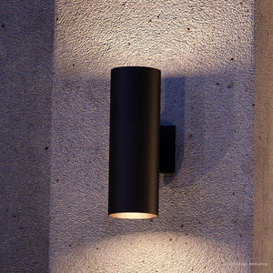 A gorgeous UHP1061 Modern Outdoor Wall Light from the Hollywood Collection by Urban Ambiance, mounted on a concrete wall.