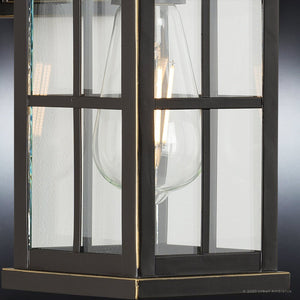 An Urban Ambiance UHP1290 Transitional Outdoor Wall Sconce, a beautiful lighting fixture with a unique glass shade.