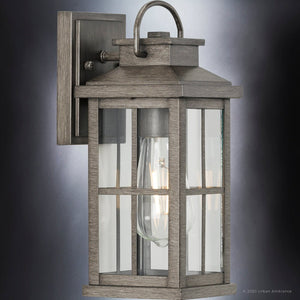 An Urban Ambiance UHP1294 Transitional Outdoor Wall Sconce in Aged Pewter Finish from the Anaheim Collection, offering a beautiful gray aesthetic.