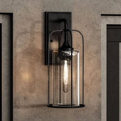 A unique UHP1301 Farmhouse Outdoor Wall Sconce with a glass shade.