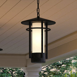 Two unique UHP1312 Mid-Century Modern luxury lighting fixtures hanging from a porch, by Urban Ambiance.