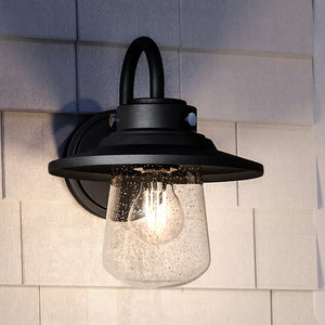 A beautiful Urban Ambiance UHP1320 Coastal Outdoor Wall Sconce 11''H x 9''W, Midnight Black Finish, Santa-Ana Collection with a clear glass shade.