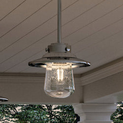 A beautiful lighting fixture, the Urban Ambiance UHP1324 Coastal Outdoor Pendant 8''H x 9''W in Stainless Steel Finish from the Santa-Ana Collection, hanging from a porch