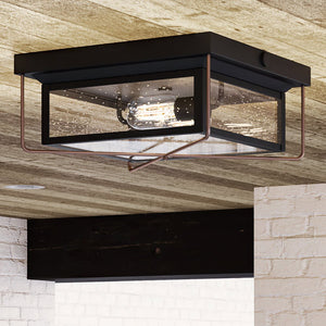 A gorgeous vintage outdoor ceiling lamp with a glass shade and an Olde Bronze Finish from the Longmont Collection by Urban Ambiance.