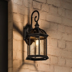 Beautiful lighting fixture on a brick wall.