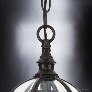 An Urban Ambiance light fixture with a unique Greensboro Collection glass globe hanging from it.