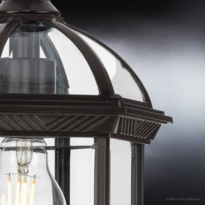 An Urban Ambiance outdoor unique light fixture with a clear bulb and Olde Bronze Finish, the UHP1373 Transitional Outdoor Pendant 13.625''H x 7.5''W,
