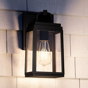 The Urban Ambiance UHP1380 Farmhouse Outdoor Wall Sconce features marine-grade construction, an Olde Bronze finish, and exposed bulb design—ideal for contemporary spaces in the Macon Collection (11.875''H x 5.5''W).
