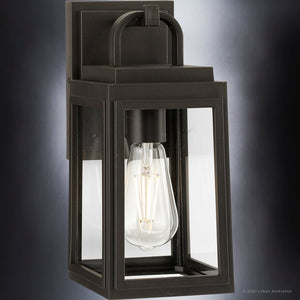 The Urban Ambiance UHP1380 Farmhouse Outdoor Wall Sconce from the Macon Collection features marine-grade, corrosion-resistant construction in an Olde Bronze finish, measuring 11.875''H x 5.5''W—perfect for modern outdoor lighting.