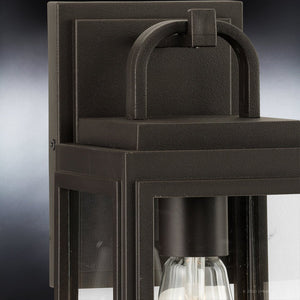 Close-up of the UHP1380 Farmhouse Outdoor Wall Sconce by Urban Ambiance, 11.875''H x 5.5''W, from the Macon Collection, featuring marine-grade olde bronze construction and a visible bulb—ideal for contemporary outdoor spaces.