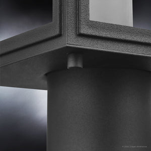 Close-up of the Urban Ambiance UHP1384 Farmhouse Outdoor Post Light from the Macon Collection, 15.625''H x 7''W, with an olde bronze marine-grade finish and clear glass panels, shown against a blurred background.