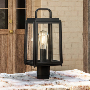 An UHP1384 Farmhouse Outdoor Post Light 15.625''H x 7''W, Olde Bronze Finish from the Macon Collection by Urban Ambiance brightening a stone table