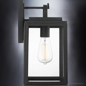 The UHP1386 Farmhouse Outdoor Wall Sconce by Urban Ambiance features a marine-grade, midnight black finish and clear glass enclosure, providing modern, corrosion-resistant exterior lighting from the Macon Collection. Measures 13.625