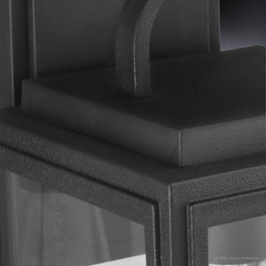 Close-up of the Urban Ambiance UHP1386 Farmhouse Outdoor Wall Sconce from the Macon Collection, featuring a 13.625''H x 7.125''W marine-grade, corrosion-resistant midnight black finish—ideal for modern exterior lighting.