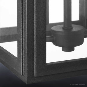 Close-up of the Urban Ambiance UHP1387 Farmhouse Outdoor Wall Sconce, 17''H x 9''W from the Macon Collection, featuring a midnight black, marine-grade metal frame that highlights corner details and part of the internal fixture.