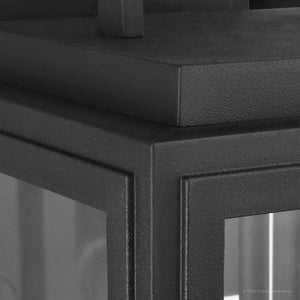 Close-up of the UHP1387 Farmhouse Outdoor Wall Sconce by Urban Ambiance, 17''H x 9''W, Macon Collection, featuring a corrosion-resistant midnight black marine-grade metal and glass build with a textured surface and sharp edges.