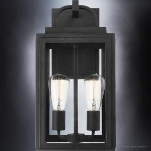 The UHP1387 Farmhouse Outdoor Wall Sconce from Urban Ambiance's Macon Collection features a marine-grade, corrosion-resistant midnight black finish, two exposed bulbs, and measures 17''H x 9''W—perfect for stylish durability outdoors.