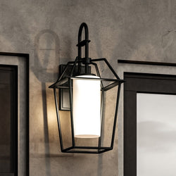 A unique UHP1391 Minimalist Outdoor Wall Sconce lighting fixture with a glass shade in Midnight Black Finish, Chandler Collection by Urban Ambiance.