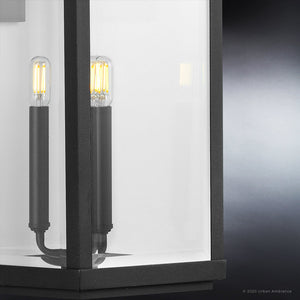 A gorgeous, transitional Outdoor Wall Sconce from the Calderdale Collection with a Midnight Black Finish and two bulbs in it.
